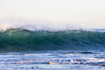 Wall Mural - Wall of wave breaking with water splash.