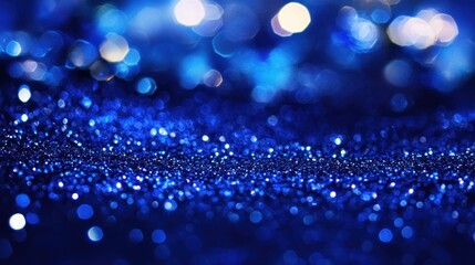Deep blue glitter texture with bokeh background.