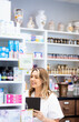 © Zoran Zeremski - Portrait of female pharmacist in drugstore.