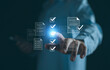 © AKACHA - Checklist business performance monitoring concept, Businessman doing online survey filling out check digital form task, online survey question form, target marketing planning with quality control.