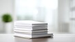 © Nattapol - Stack of white paper on wooden table with blurred background