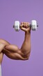 © OleksandrZastrozhnov - Young adult male holding dumbbell against purple background displaying strength and fitness