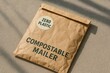© Татьяна Евдокимова - Close up of a compostable mailer with a zero plastic sticker, highlighting eco friendly packaging solutions for sustainable shipping