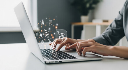 Wall Mural - hands typing on laptop keyboard, shopping cart icons float above, symbolizing online shopping, e-com