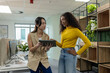 © Wavebreak Media - Diverse female colleagues standing beside desks holding tablet and viewing screens in office