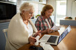 © Marko Geber - Senior lesbian couple checking medication instructions during online doctor consultation