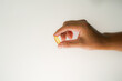 © Aria Armoko - Male hand holding soft gels, Fish oil capsules, omega 3, omega 9, vitamin D, vitamin E, supplements