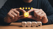 © Gebbi - Customer satisfaction and service evaluation concept. A client selects a happy smiley face and five-star icon on a wooden cube.