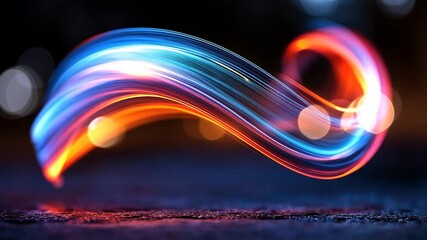 Wall Mural - abstract video of vibrant blue and red light streaks forming a dynamic wave shape against a dark, bo