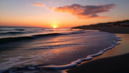 Wall Mural - close-up view of a small wave on a sandy beach at sunset. warm, orange and pink hues dominate the sk