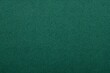 © Fadhily - A captivating view of the green fabric texture, close-up, conveying a sense of depth and uniformity