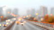 © MAX - city road bokeh view on a foggy day. Blurry lights and road with buildings in the background
