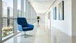 ©  Sarimo graFX - Modern office hallway with a blue chair near the window
