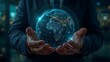 © Shefat - Hand holding a globe symbolizing global care and environmental protection