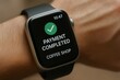 © Татьяна Евдокимова - Smartwatch screen shows a payment completed message for a coffee shop, highlighting the convenience of wearable technology in modern transactions