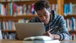 © Chandara - College student doing homework on computer stock photo --ar 16:9 --raw --v 6 Job ID: 747da057-039a-4ef3-9cd6-afa86962a1c4
