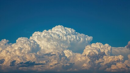 Wall Mural - a serene blue sky partially veiled by clouds