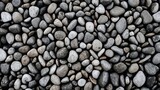 Detailed shot of gray stones gathered on the shore
