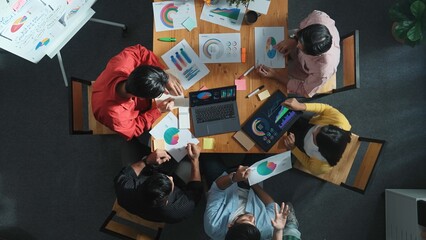 Wall Mural - top view of business team working together while talking about financial chart. close up of skilled 