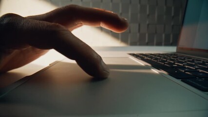 Wall Mural - Macro fingers swiping touchpad laptop in office environment. Freelancer working