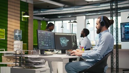 Software developer coding with AI language model assistance in office, listening music. Programmer wearing headphones integrating LLM assistant suggestions into code editor, camera A
