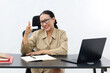 © ArvStd - Smiling attractive young civil servant woman working at a desk, pointing you or camera
