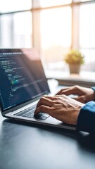 person coding on laptop