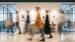 © World Images - People walking in modern office, Blurred figures in a contemporary workspace, Dynamic office interior with glass walls, Busy professional environment with motion blur.