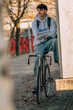 © carballo - young urban outfit riding a bicycle
