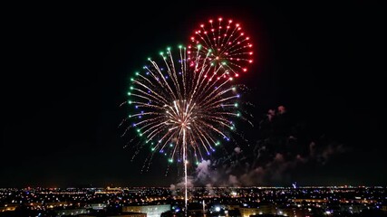 Wall Mural - fireworks in the sky above a city at night