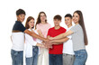 © New Africa - Group of happy teenagers joining hands on white background