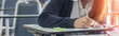 © Chinnapong - Exam at school with student's taking educational admission test in class, thinking hard, writing answer in university classroom, education and world literacy day concept