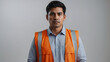 © Faraz-9461894 - A serious man in a safety vest looks directly at the camera with a neutral expression on a plain background.