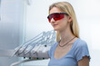© Viktoriia - A Woman in a Dental Office Wearing Protective Glasses to Shield Her Eyes from Bright Lights During an Oral Examination or Treatment Session in a Clean Clinic Environment