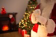 © vectorfusionart - Senior Santa figure is holding transparent panel in flat design Christmas living room, copy space
