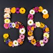 © Kim de Been - Number 56 made out of flowers with black background. Photo for 56th birthday or anniversary party