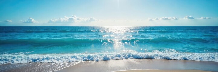 Wall Mural - Vast expanse of deep blue ocean meeting the horizon, waves gently lapping the shore, sunlit water reflecting the sky Perfect for travel, nature, and environmental themes , marine life, oceanography