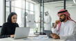 © Ummu MMM - Arab Business Professionals Collaborate on Projects in Modern Office Environment