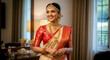 © mamasudhossen - Happy indian bride in traditional sari and gold jewelry smiling indoors
