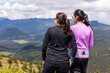 © ADDICTIVE STOCK - Hiking group enjoying mountain view with friends