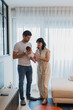 © ADDICTIVE STOCK - Parents with newborn in cozy living room setting