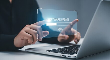 Software update on a laptop is being installed by a person, highlighting technology and the progress bar on the screen