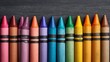 © Harry - Vibrant crayons arranged neatly on a textured dark background, creating a visually appealing and colorful artistic composition for any project.