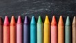 © Harry - Vivid crayons lined up against chalkboard, creating colorful and textured composition perfect for school, art, or creative projects