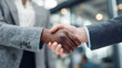 © IA Tuga - Professional interracial handshake between confident business partners in a modern corporate setting