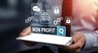 © Habiba - A person holds a tablet displaying non profit with various business and communication icons