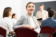 © JackF - Young smiling woman attending lecture in university