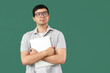 © Pixel-Shot - Male programmer with laptop on green background