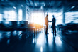 © Aa - Business people shaking hands in blurred motion modern office setting, motion blur Business concept, motion bokeh background