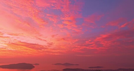 Wall Mural - aerial view of colorful cloud above the Phuket Ocean. Clouds are moving slowly in stunning sunset video 4K. Nature video High quality footage Scene of Colorful romantic sky sunset background.